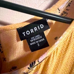 Yellow thin material with shoulder openings.